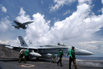 Us navy 040608 n 4190w 001 an f a 18 hornet passes over the flight deck during air operations aboard uss john f. kennedy %28cv 67%29