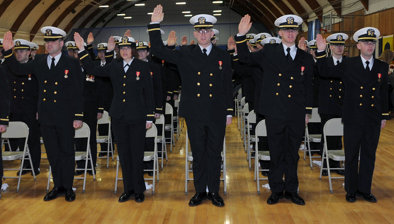 Us navy 110311 n wq300 023 more than 80 officer candidates take the oath of office during a commissioning ceremony at navy officer candidat